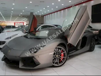 Cars For Sale Lamborghini  Aventador  Roadster  0  Gray  Coupe / Sport  F-1  AWD  Leather  2015  12  No  Gasoline