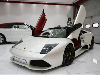 Cars For Sale Lamborghini  Murcielago  Roadster  5,186  White  Convertible  F-1  AWD  Leather  2009  12  No  Gasoline