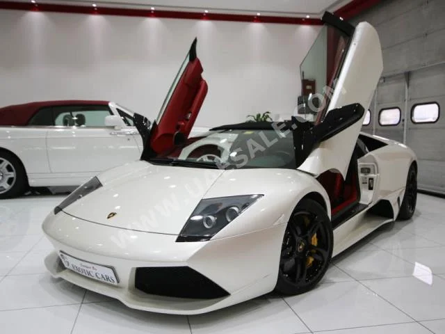 Cars For Sale Lamborghini  Murcielago  Roadster  5,186  White  Convertible  F-1  AWD  Leather  2009  12  No  Gasoline