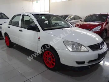 Cars For Sale Mitsubishi  Lancer  160,000  White  Sedan  Automatic  FWD  Cloth  2011  4  No  Gasoline