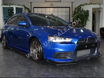 Cars For Sale Mitsubishi  Lancer  Evolution  100,000  Blue  Sedan  Manual  AWD  Cloth  2009  4  No  Gasoline