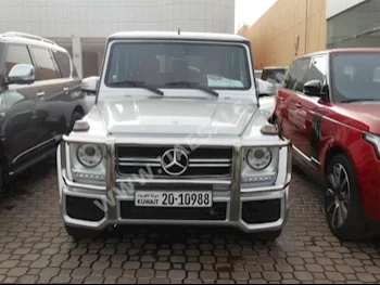 Cars For Sale Mercedes-Benz  G-Class  55 AMG  100,000  Silver  SUV  Automatic  4WD  Leather  2012  8  Yes  Gasoline