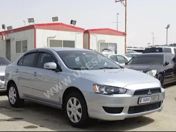 Cars For Sale Mitsubishi  Lancer  EX  68,000  Silver  Sedan  Automatic  FWD  Leather  2015  4  No  Gasoline