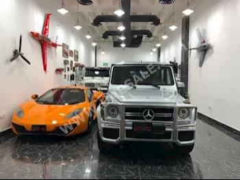 Cars For Sale Mercedes-Benz  G-Class  55 AMG  63,000  Silver  SUV  Automatic  4WD  Leather  2014  8  Yes  Gasoline