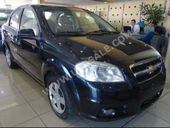 Cars For Sale Chevrolet  Aveo  LS  70,000  Black  Sedan  Automatic  FWD  Cloth  2014  4  No  Gasoline