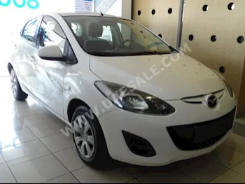 Cars For Sale Mazda  Mazda 2  140,000  White  Sedan  Automatic  FWD  Cloth  2013  4  No  Gasoline