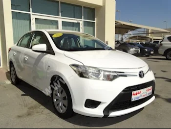 Cars For Sale Toyota  Yaris  100,000  White  Sedan  Automatic  FWD  Cloth  2014  4  No  Gasoline