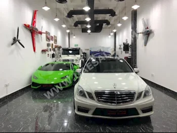 Cars For Sale Mercedes-Benz  E-Class  63 AMG  34,000  White  Sedan  Automatic  RWD  Leather  2010  6  Panorama  Gasoline