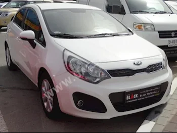 Cars For Sale Kia  Rio  6,000  White  Hatchback  Automatic  FWD  Cloth  2014  4  No  Gasoline