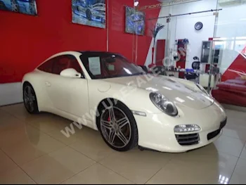 سيارات للبيع بورش  911  تارجا 4اس  94,000  ابيض لؤلؤي  كوبيه \ سبورت  تبترونك  دفع خلفي  جلد  2009  6  بانوراما  بنزين