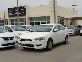 Cars For Sale Mitsubishi  Lancer  EX  100,000  White  Sedan  Automatic  FWD  Cloth  2015  4  No  Gasoline