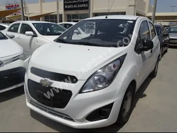 Cars For Sale Chevrolet  Spark  105,000  White  Hatchback  Automatic  FWD  Cloth  2015  4  No  Gasoline