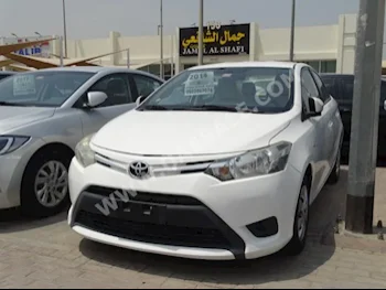 Cars For Sale Toyota  Yaris  140,000  White  Sedan  Automatic  FWD  Cloth  2014  4  No  Gasoline
