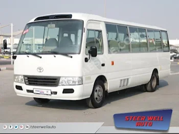 Cars For Sale Toyota  Coaster  331,843  White  Van / Bus  Manual  RWD  Cloth  2015  4  No  Gasoline