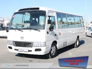 Cars For Sale Toyota  Coaster  323,557  White  Van / Bus  Manual  RWD  Cloth  2016  4  No  Gasoline
